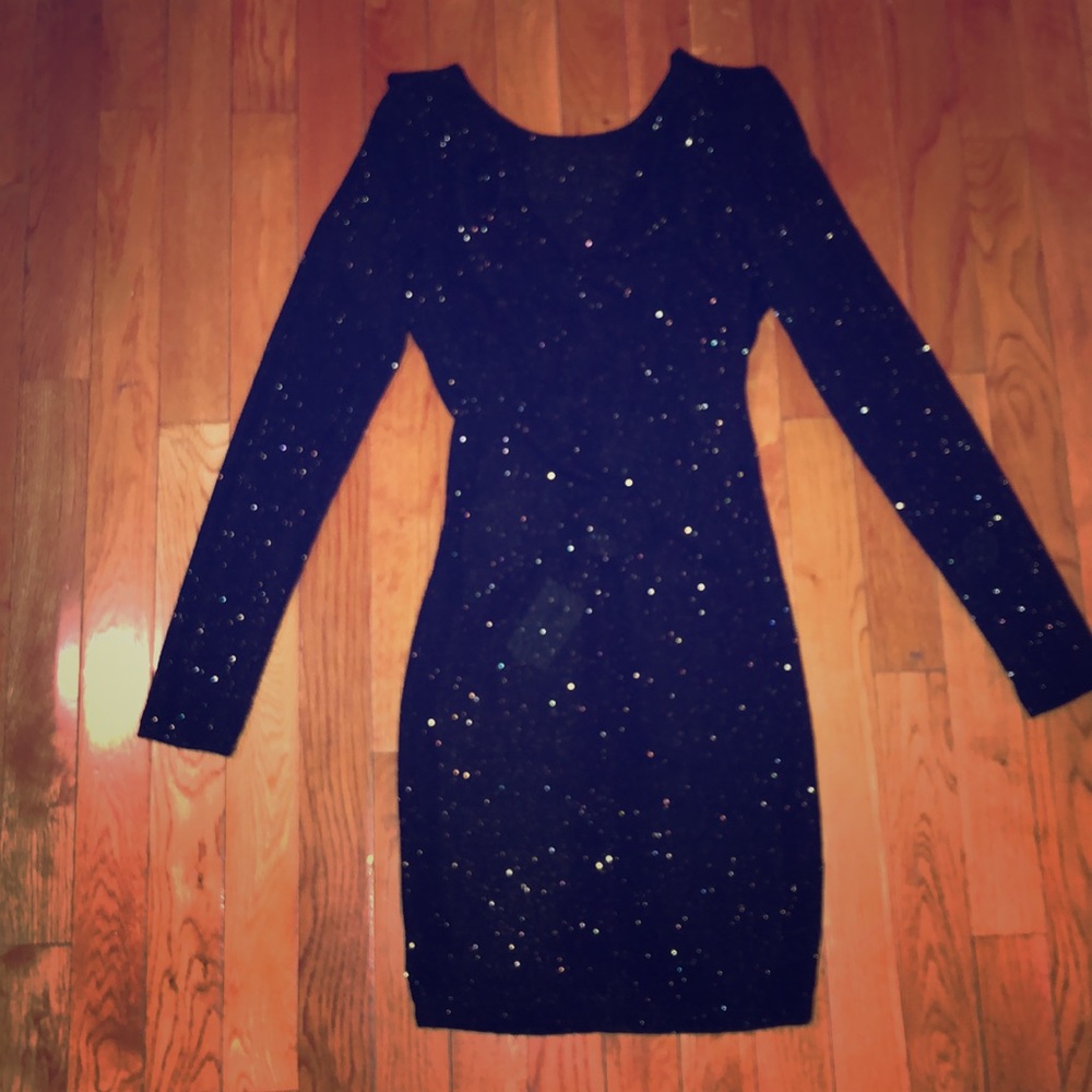 Black and gold backless dress .